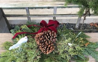 Christmas wreath arrangement with pinecone