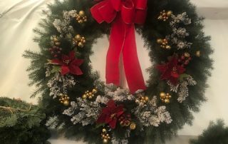 evergreen holiday wreath with red bow