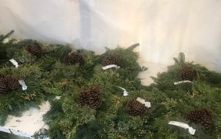 evergreen arrangements with pinecones