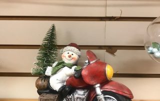statuette of snowman on a motorcycle